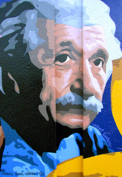 Mural art painting of genius scientist Albert Einstein facing to the right and looking at the viewer.