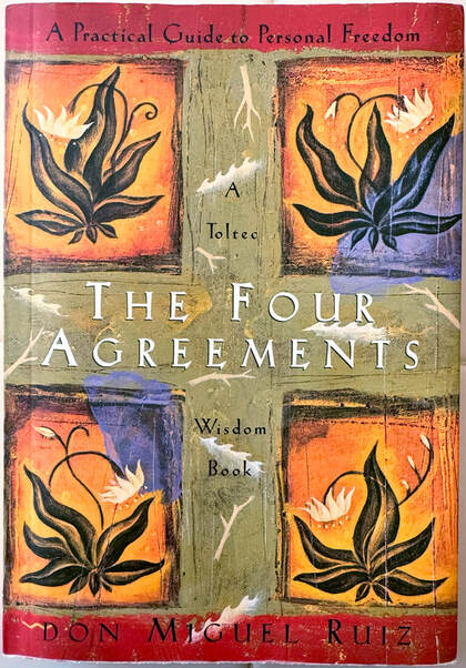 Front book cover of ‘The Four Agreements’ – promoting four simple adjustments we can make to our life that would improve our overall well-being – by Mexican author of Toltec spiritual wisdom Don Miguel Ruiz.