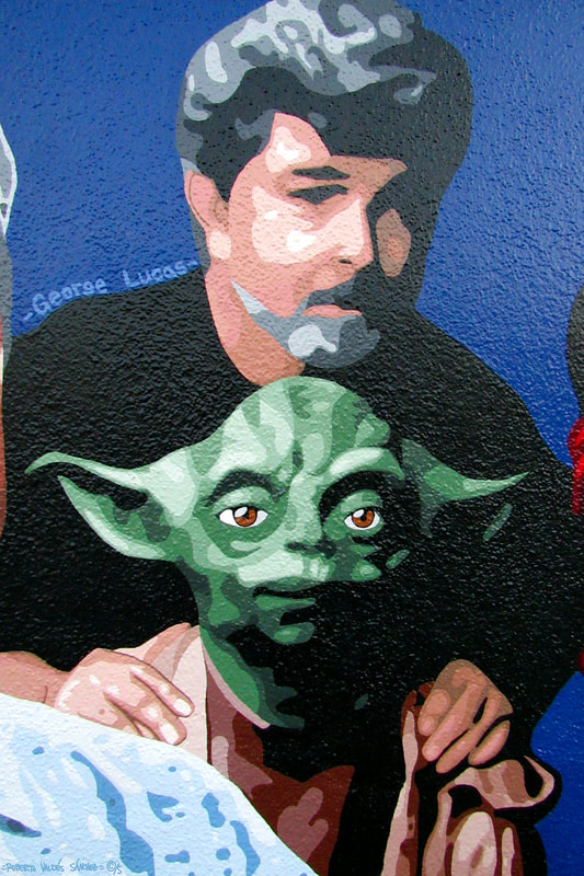 Mural art portrait painting of filmmaker George Lucas with Yoda from Star Wars.